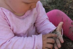 child playing with dirt