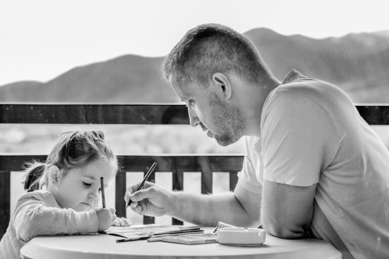 image of child following her father's instructions to write